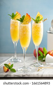 Summer Time Peach Mimosa Or Bellini In Flute Glasses, Brunch Cocktail