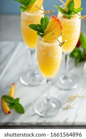 Summer Time Peach Mimosa Or Bellini In Flute Glasses, Brunch Cocktail