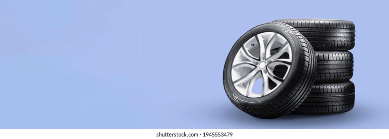 summer tires and wheels-stack on blue background, new wheels long blank layout copyspace