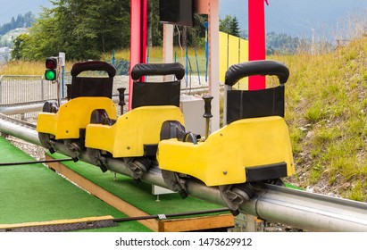 Summer Toboggan Sled At Summer Sunny Day. Recreational Rail Transport For Leisure Activity