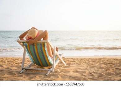 Summer Travel Beach Vacation Concept, Traveler Asian Woman With Straw Hat Relax On Chair Beach At Koh Mak, Trad, Thailand