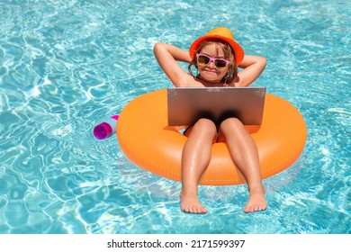 Summer Travel And Business Concept. Kid With Laptop In Pool Water In Summer Day. Waterproof Laptop.