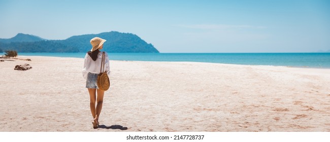 Summer travel vacation concept, Happy traveler asian woman relax and sightseeing on beach in evening at Koh Lipe, Satun, Thailand, - Shutterstock ID 2147728737