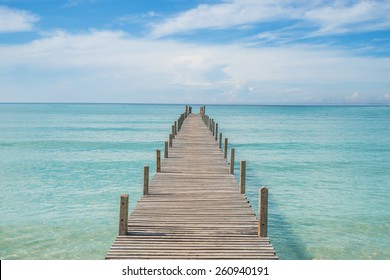 Summer, Travel, Vacation and Holiday concept - Wooden pier in Phuket, Thailand. 