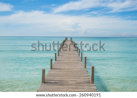 Summer, Travel, Vacation and Holiday concept - Wooden pier in Phuket, Thailand. 
