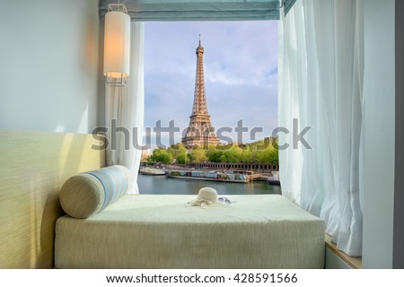 Summer, Travel, Vacation and Holiday in Paris ,France. Beautiful Eiffel tower view at window in resort near Seine river, Paris ,France.
