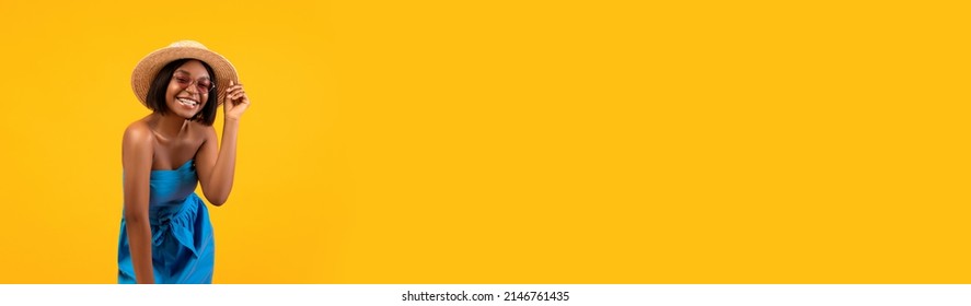 Summer Travels. Happy Young African American Woman In Straw Hat And Sunglasses Posing Over Yellow Background, Wide Horizontal Banner With Black Lady In Beach Vacation Outfit, Panorama With Copy Space - Powered by Shutterstock