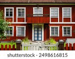 Summer trip to Sweden. Exploring Scandinavia by car. Eksjö,  Jönköping County, Sweden. Colorful Swedish houses and narrow streets. Background for stories about traveling to Nordic countries. 