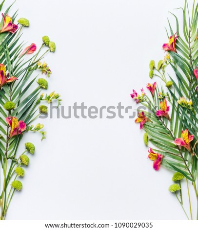 Tropical palm leaves and exotic flower frames