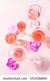 Summer Tropical Pink Cocktail In A Different Glasses Decorated Pink Orchid Flowers. Top View.