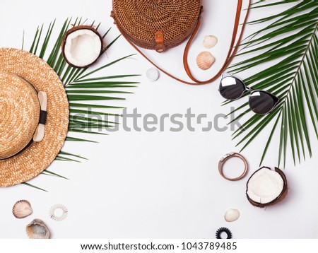 Summer vacation accessories on the white background, top view
