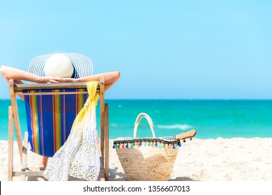 Summer Vacation. Asian Lifestyle Healthy Woman Relaxing And Happy On Beach Chair With Cocktail Coconut Juice In Holiday Summer.  Chill And Freedom Outdoor In The Summertime.  Travel And Lifestyle 