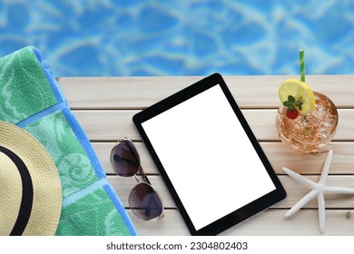 Summer vacation beach blank screen ipad e-reader mock up. - Shutterstock ID 2304802403