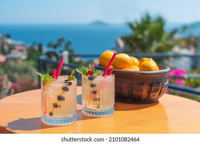 Summer vacation concept with cocktails. Drinking cold cocktails with sea view in summer