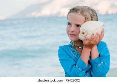 Summer Vacation - Listening To The Sea - Beautiful Girl With Shell At The Beach