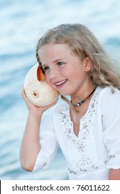 Summer Vacation - Listening To The Sea - Beautiful Girl With Shell At The Beach