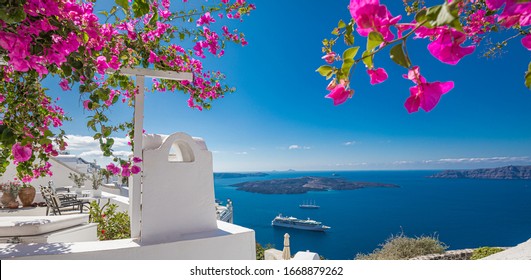Summer vacation panorama, luxury famous Europe destination. White architecture in Santorini, Greece. Perfect travel scenery with pink flowers and cruise ship in sunlight and blue sky. Amazing view