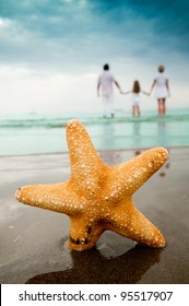 Summer Vacation - Portrait Of  Family At The Beach