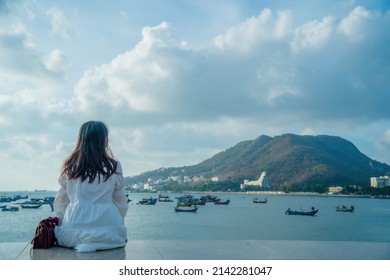 Summer Vacation. Smiling Asian Women Relaxing And Standing, Walking On The Beach Vung Tau, So Happy And Luxury In Holiday Summer, Outdoors Cinematic Sky Background. Travel And Lifestyle Concept.