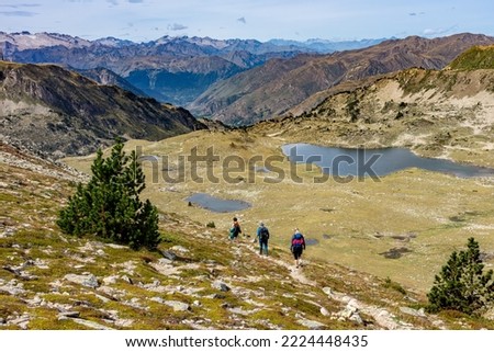Summer vacation in the Spanish Pyrenees: Hike to the Baciver lake landscape in the Alt Pirineu nature reserve - Panoramic view of distant 3000m peaks and glaciers