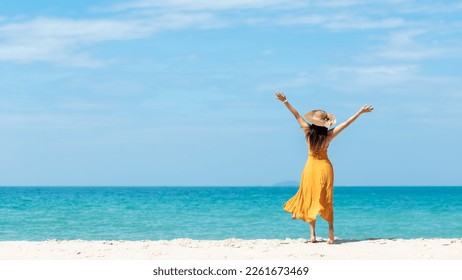 Summer vacations. Lifestyle woman relax and chill on beach background.  Asia happy young people with white dress raise arm on the wave sea, summer trips walking enjoy  tropical beach. Lifestyle - Powered by Shutterstock