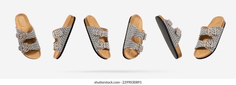 Summer Vegan cork sandals with straps floating from different sides on light gray background. Fashionable female trendy slippers. Eco-friendly natural shoes. Creative concept objects for design. - Powered by Shutterstock