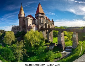 Summer view on Corvin castle with bridge  over a small river in a sunny day in Romania