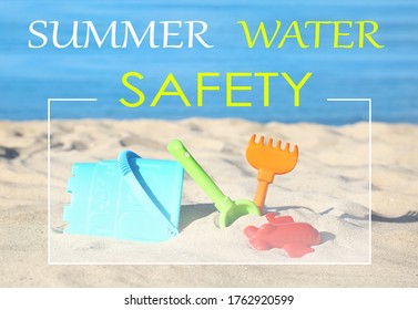 Summer Water Safety. Set Of Plastic Beach Toys On Sand Near Sea