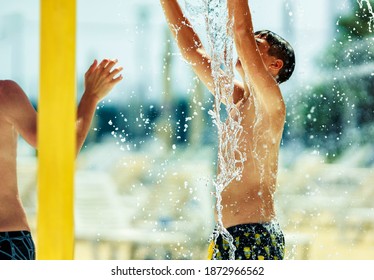 Summer Water Splash Party People Having Fun On The Water Slide, Water Resort In The Waterpark Fun Aqua Glides Playing Happy In The Sunlight And Water Splashes Are All Over On Blue Sky In The Summer