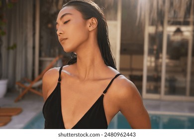 Summer Woman In Black Swimsuit Relaxing By Poolside In Sunlight - Powered by Shutterstock