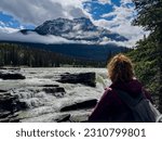 Summer and young woman in Athabasca Falls, Jasper National Park, Canadan rockies