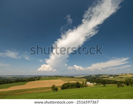 Summerlandscape with Rolling Hills and Dramatic Cloud in the Mostviertel, Lower Austria