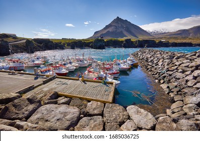 Summertime, Beautiful panoramic view of Fishing ships (boats) in Arnarstapi harbor at Snaefellsnes peninsula in West Iceland. Famous landmark. Fishing village. Travelling concept background. Postcard.