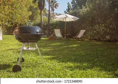 Summertime fun. Barbecue for summer family dinner in the backyard of the house. - Shutterstock ID 1721348890