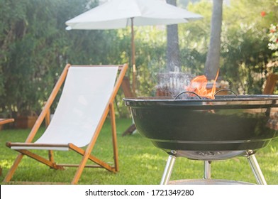 Summertime Fun. Barbecue For Summer Family Dinner In The Backyard Of The House.