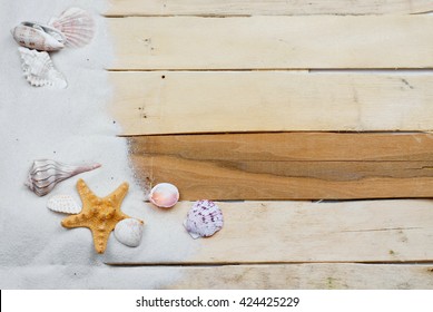 Summertime Image With Beach Like Theme Of Clean White Sand Scattered On Boardwalk Planks With Starfish And Seashells Making A Side Border. Plenty Of Texture. Horizontal Composition.