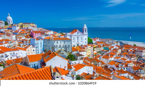 Summertime sunshine day cityscape in the Alfama - historic old district Alfama in Lisbon, Portugal.