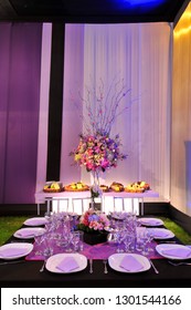 Summery Table Centrepieces At A Lavish Garden Wedding Ceremony.