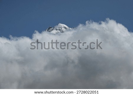 the summit of the Aiguille Verte with clouds