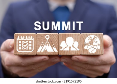 Summit Concept. Political Meeting, Conference, Global Governance Event. Politician Holding Wooden Cubes With Icons And Summit Word.