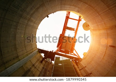 Sump or Circle Sinking manhole with concrete Wall Friction and machine for move the equipment at the  tunnel construction in working shaft underground .