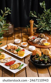 Sumptuous array of mediterranean dishes artistically presented on a warm wooden backdrop