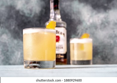 SUMY, UKRAINE - DEC 22, 2020: Whiskey sour made of Jim Beam - one of the best-selling brands of bourbon in the world.