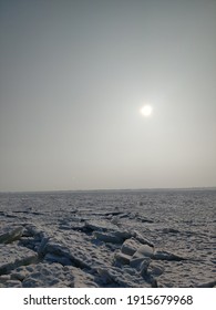 Sun Above Frozen Artificial Lake