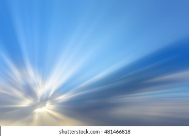 Sun beams or light rays breaking through the clouds. Beautiful spectacular conceptual meditation abstract artistic motion blur background.