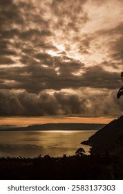 As the sun began to set, its light was reflected in the lake's calm waters, creating a breathtakingly beautiful scene of golden hues and soft shadows.