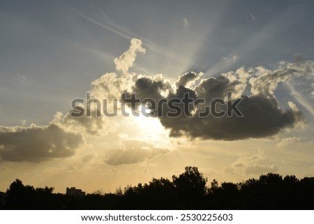 Sun behind clouds over Buenos Aires