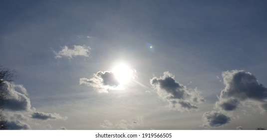 The Sun Behind Dark Clouds