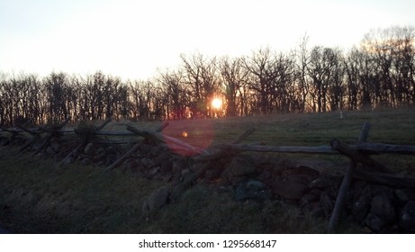 Sun Behind The Wood Barricade