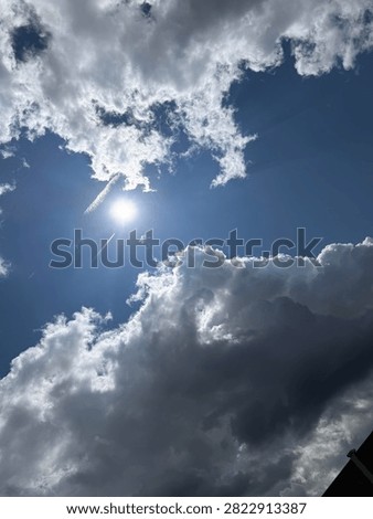Sun between the clouds in the sky